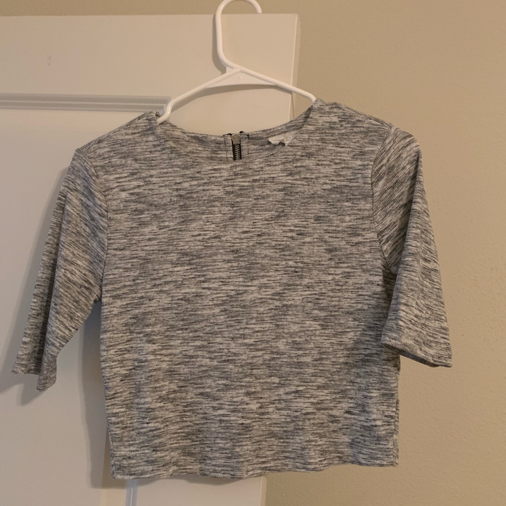 Grey top with a zipper in the back